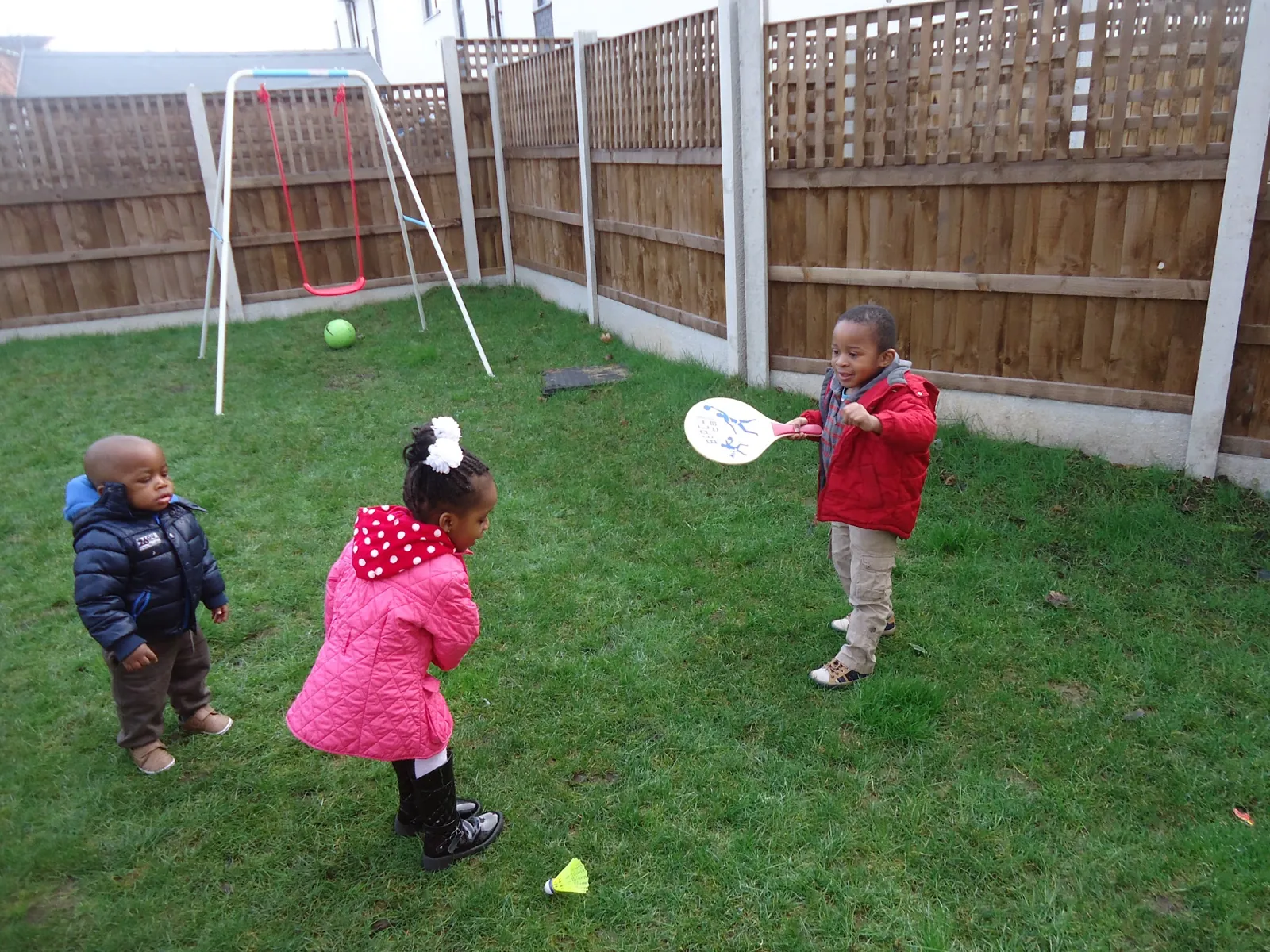 Children playing ball games in the garden